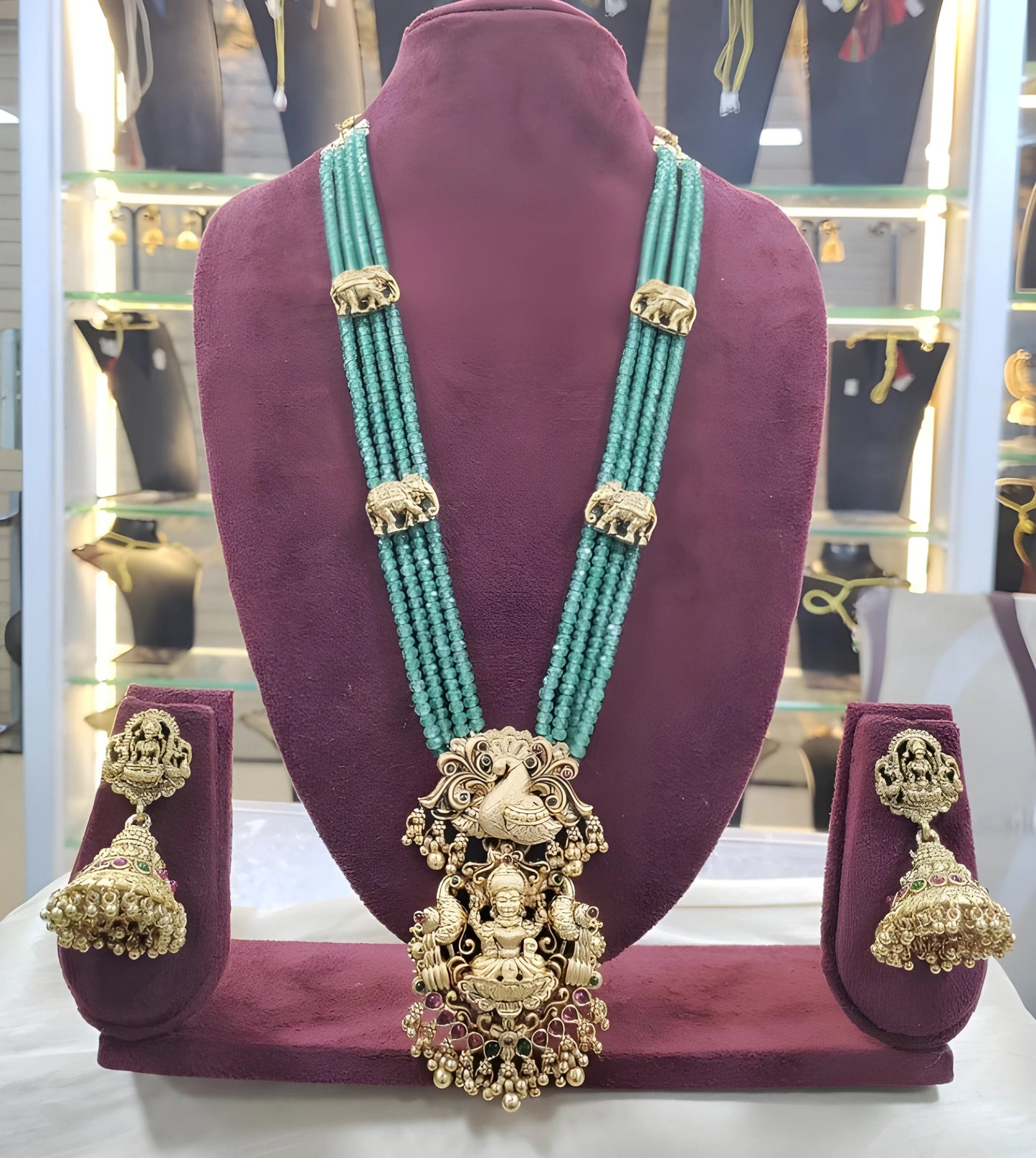 Jewel City Luxurious Emerald Green Temple Goddess Kundan Jewelry Set - Handcrafted Gold-Plated Bridal Necklace with Jhumka Earrings