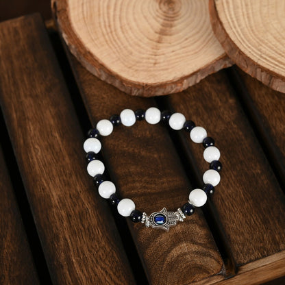 NVR Women & Men Black & White Evil Eye Elasticated Rakhi With Roli Chawal
