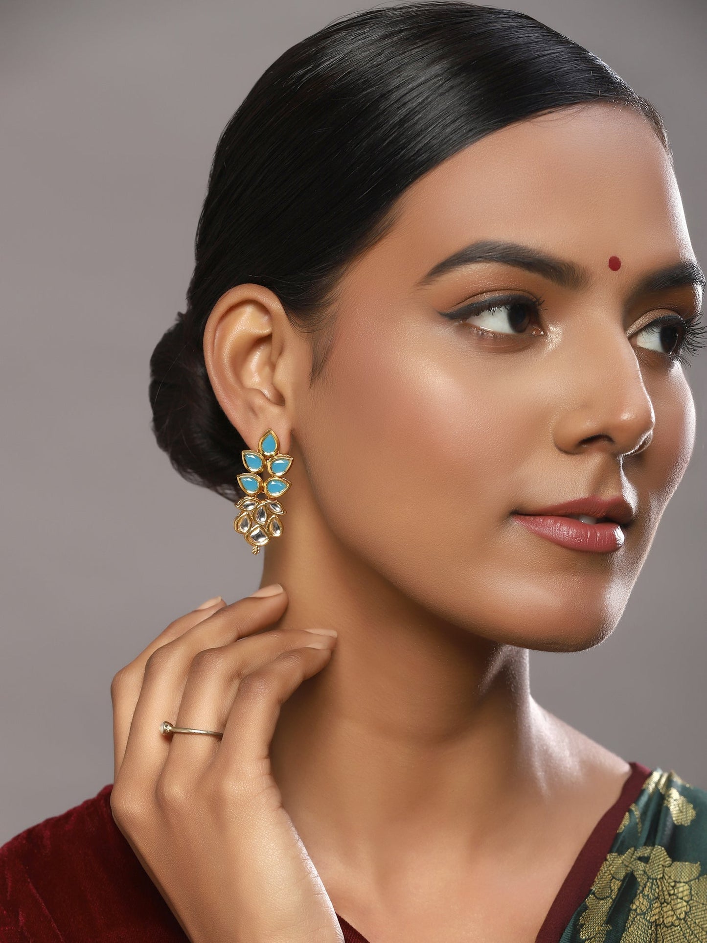 Gold-Toned Leaf Shaped Studs Earrings - Ruby Raang