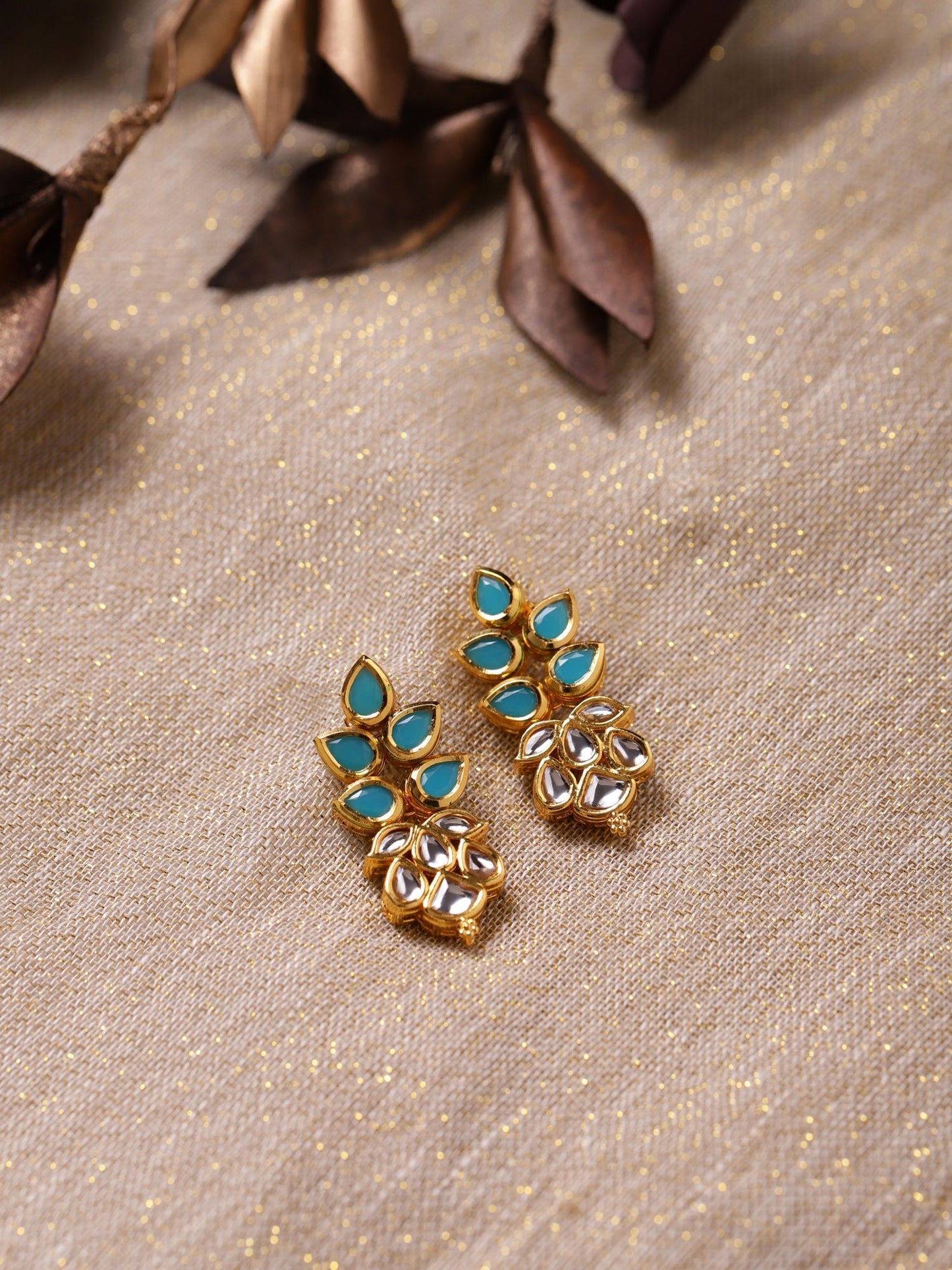 Gold-Toned Leaf Shaped Studs Earrings - Ruby Raang