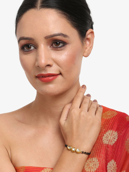 Black Gold-Toned Kundan Bracelet Mangalsutra - Ruby Raang