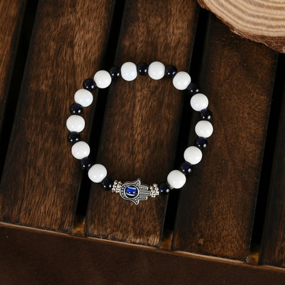 NVR Women & Men Black & White Evil Eye Elasticated Rakhi With Roli Chawal