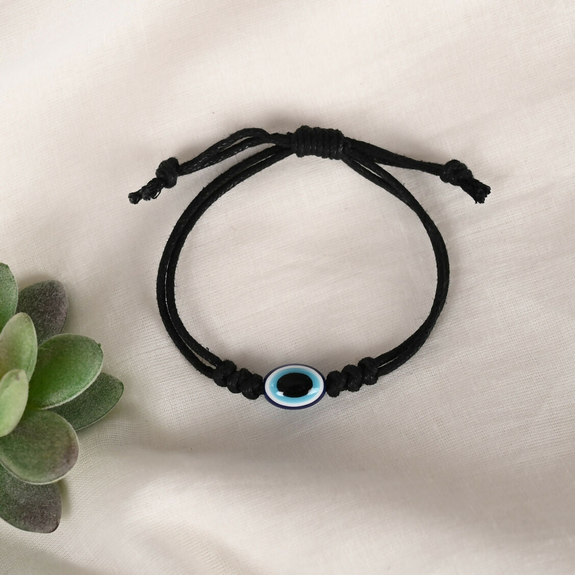 NVR Women & Men Black Evil Eye Rakhi With Roli Chawal