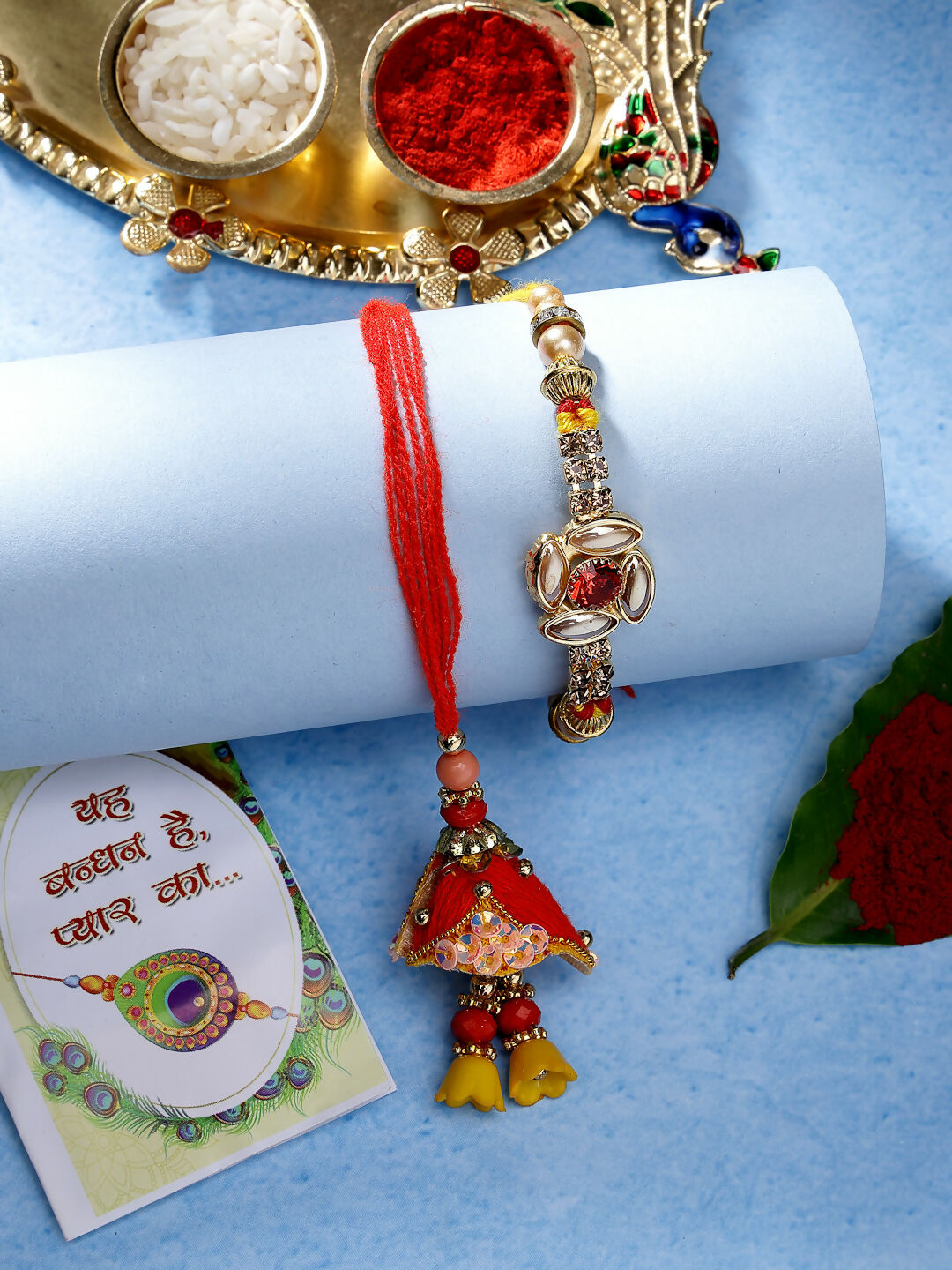 NVR Women & Men Set of 2 Red & Gold-Toned Stone-Studded Bhaiya Bhabhi Rakhi With Roli Chawal & Chocolate