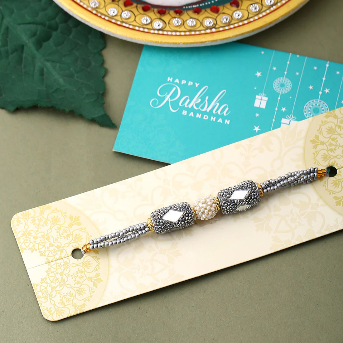 trueBrowns X Voylla Silver Beaded Rakhi With Roli Chaawal Pack