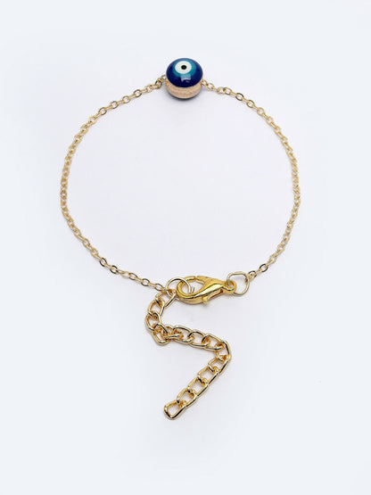 NVR Women Gold-Toned Evil Eye Rakhi With Roli Chawal