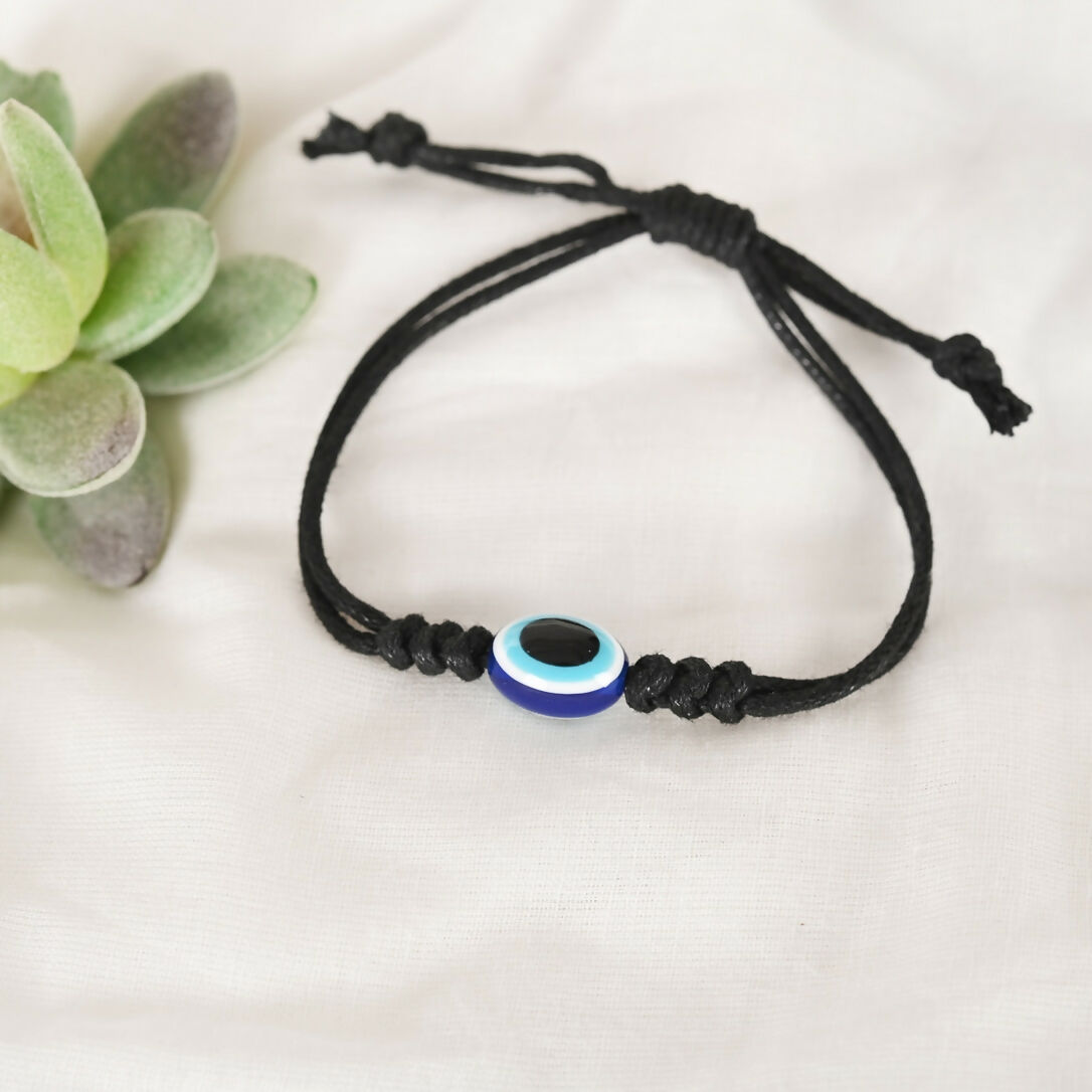 NVR Women & Men Black Evil Eye Rakhi With Roli Chawal
