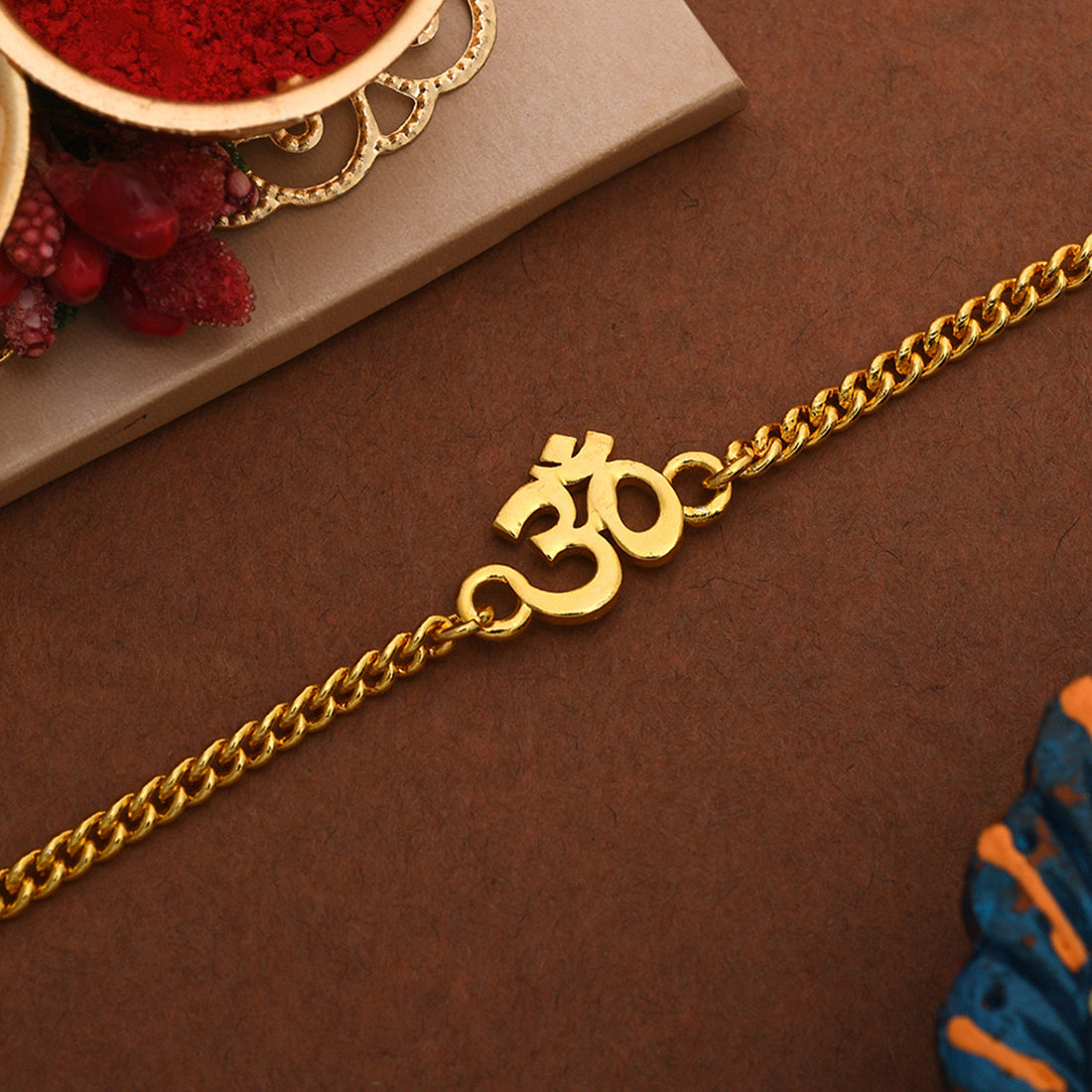 trueBrowns Auspicious Gold Tone Brass Om Bracelet Style Rakhi