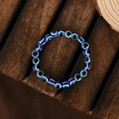 NVR Women & Men Blue Evil Eye Rakhi With Roli Chawal