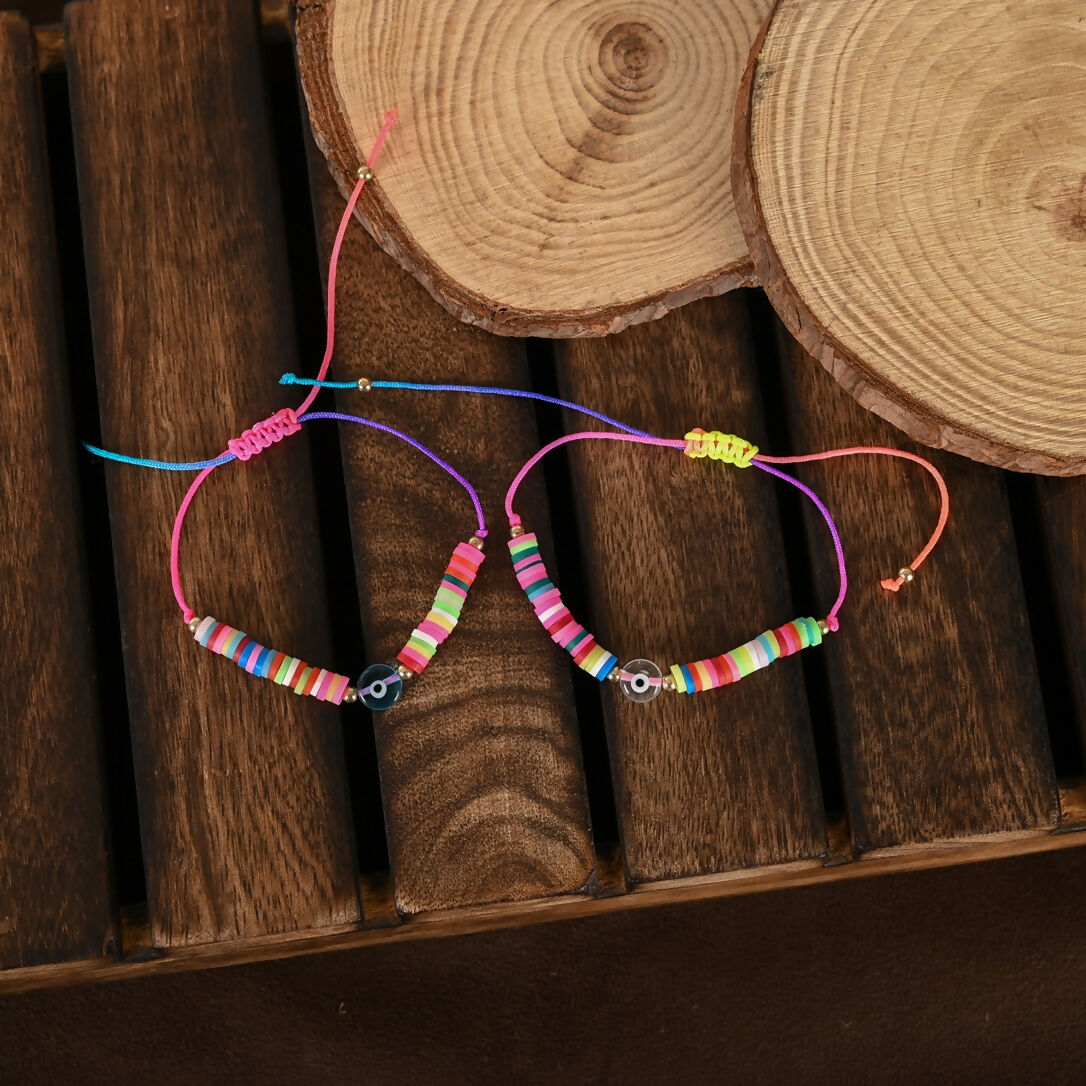 NVR Women & Men Set of 2 Multicolor Evil Eye Rakhi With Roli Chawal