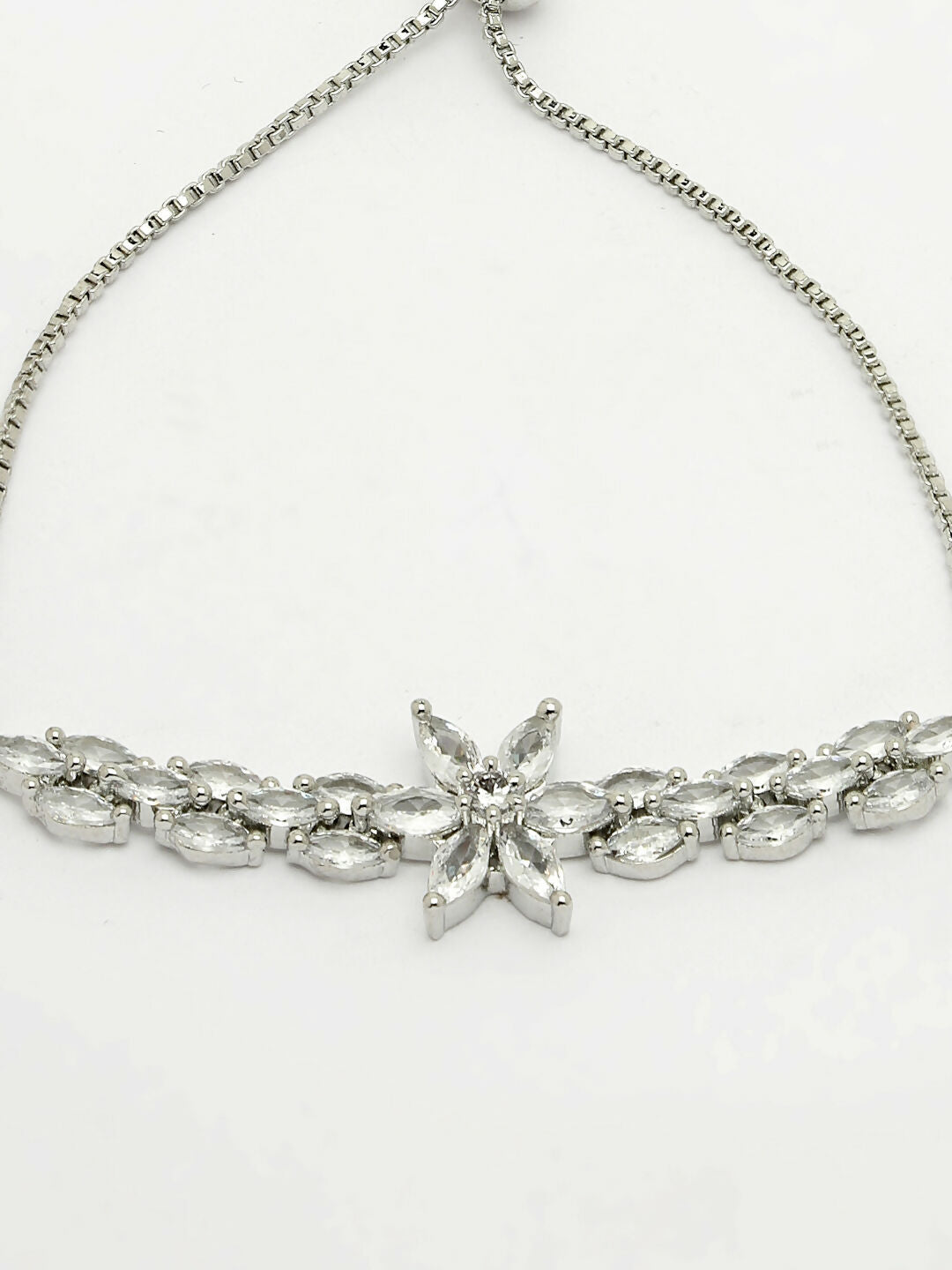 NVR Women Silver-Plated American Diamond Studded Rakhi With Roli Chawal
