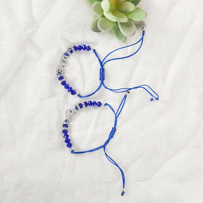 NVR Women & Men Set of 2 Blue Evil Eye Rakhi With Roli Chawal