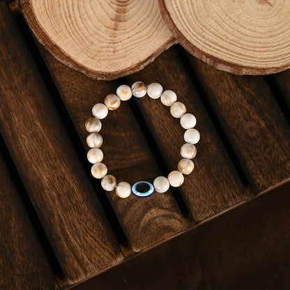 NVR Women & Men Cream-colored Evil Eye Elasticated Rakhi With Roli Chawal