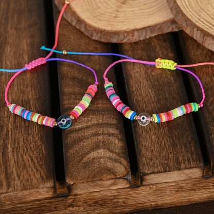NVR Women & Men Set of 2 Multicolor Evil Eye Rakhi With Roli Chawal