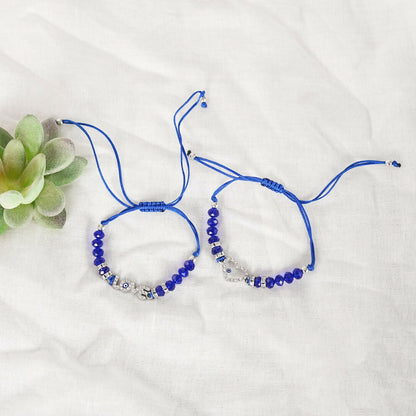 NVR Women & Men Set of 2 Blue Evil Eye Rakhi With Roli Chawal