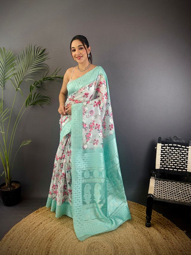 Elora Cyan Blue Silk Floral Motifs Coppery Tone Contrast Floral Border Banarasi Saree