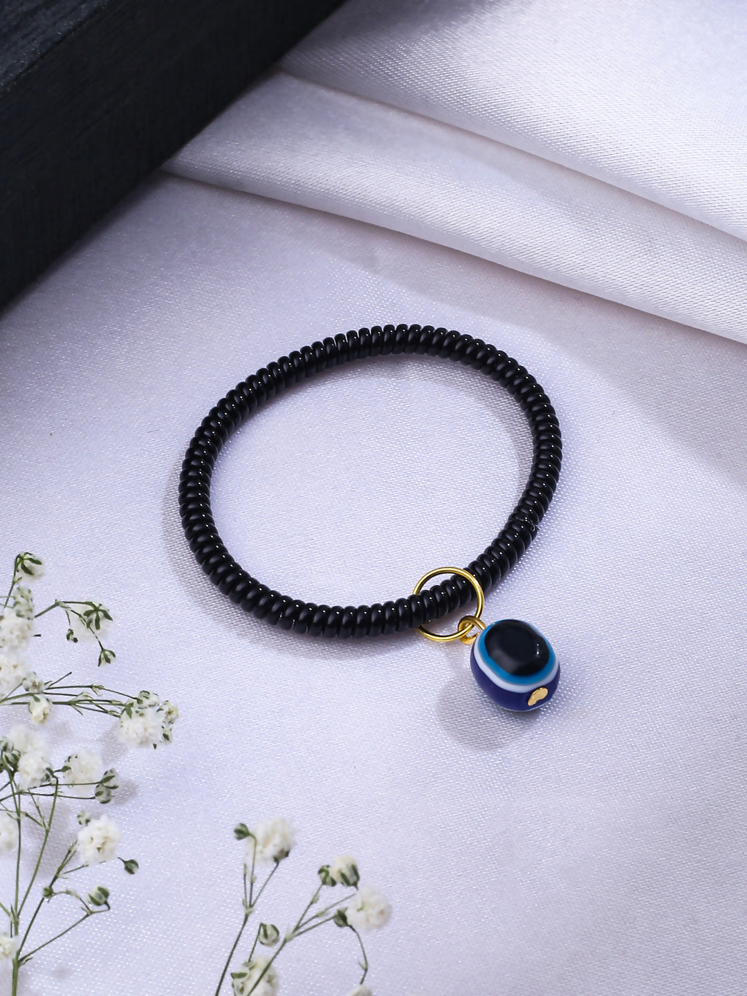 NVR Women & Men Black Evil Eye Spring Ring Rakhi With Roli Chawal