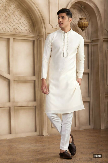Raivat Ethnic Banarasi Art Silk Mirror Work Kurta Pajama In Cream Colour