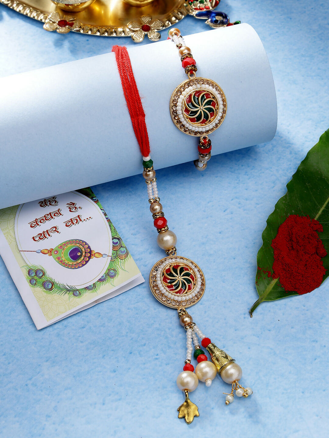 NVR Women & Men Set of 2 Gold-Toned Stone-Studded & Beaded Bhaiya Bhabi Rakhi With Roli Chawal