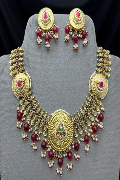Vastrabhushan Antique Gold Kundan Necklace Set | Indian Bridal Jewelry with Pearls & Red Stones