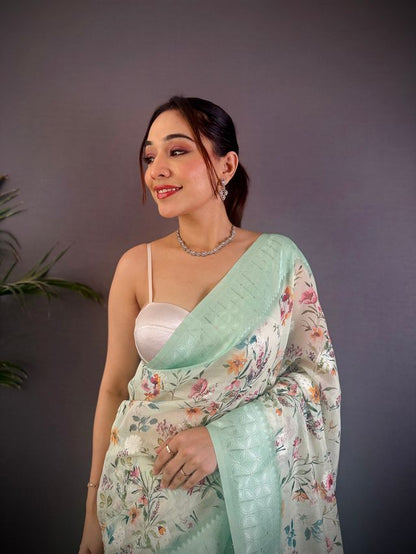 Elora Cyan Blue Silk Floral Motifs Coppery Tone Contrast Floral Border Banarasi Saree