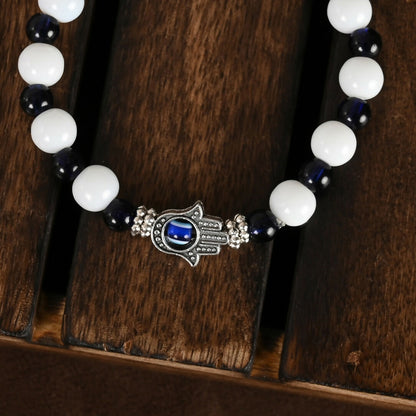 NVR Women & Men Black & White Evil Eye Elasticated Rakhi With Roli Chawal