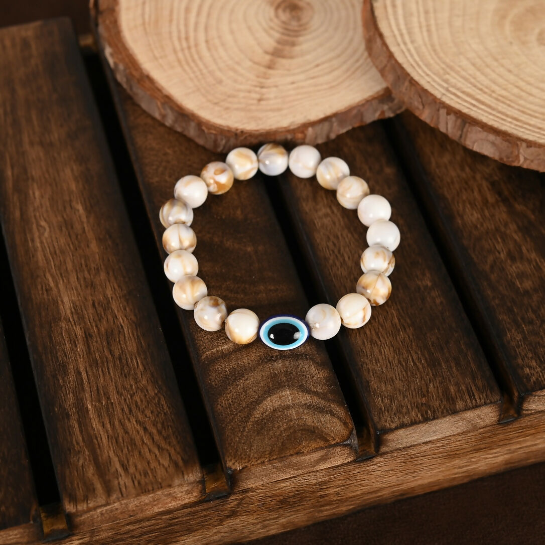 NVR Women & Men Cream-colored Evil Eye Elasticated Rakhi With Roli Chawal