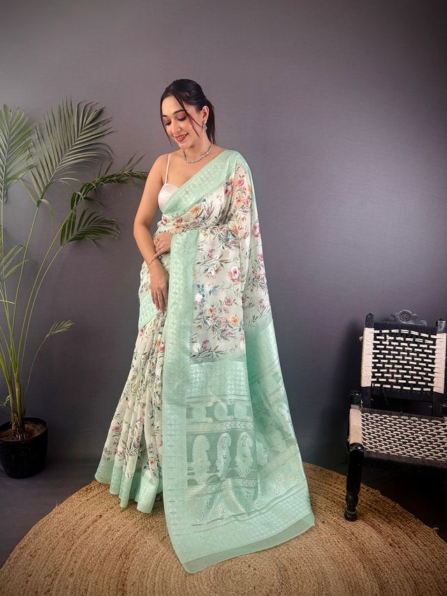 Elora Cyan Blue Silk Floral Motifs Coppery Tone Contrast Floral Border Banarasi Saree
