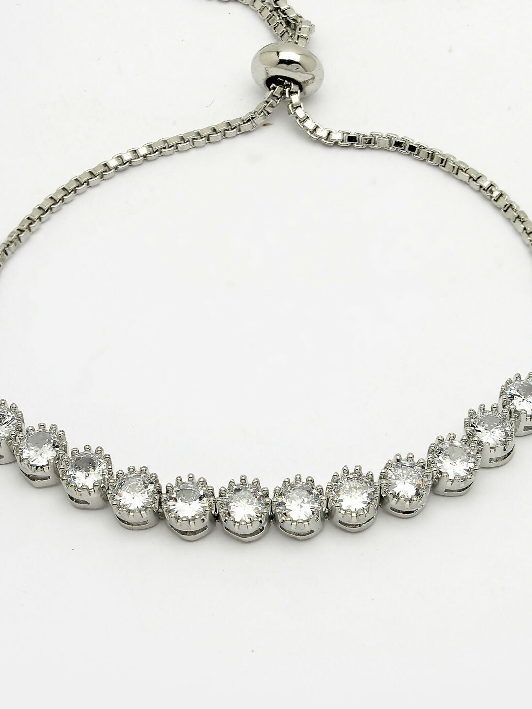 NVR Women Silver-Plated American Diamond Studded Rakhi With Roli Chawal
