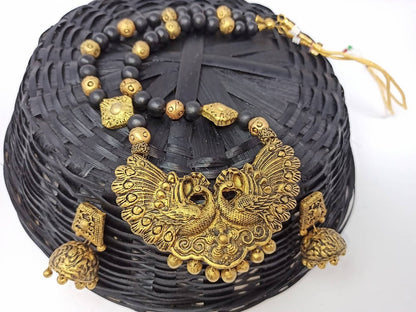 Terracotta Long Necklace Set With Peacock Pendant With Temple Jhumkas-Black And Gold